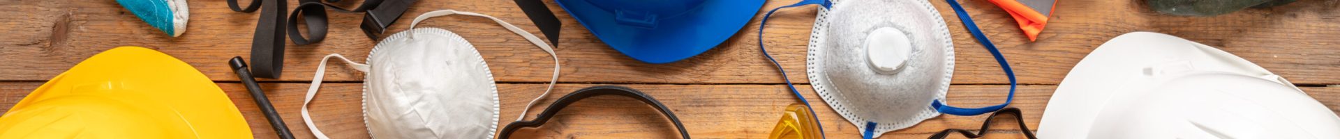 Labor personal protective gear flat lay. Work health and safety for industry and construction site. Protection equipment on wooden background, banner